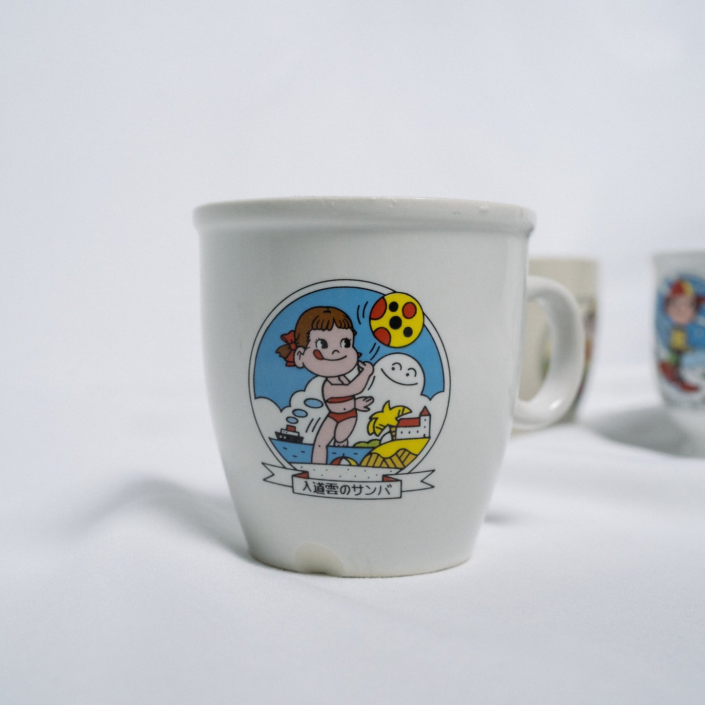 "𣎴二家" Peko Mug 牛奶妹布丁杯 - 入道雲のサンバ