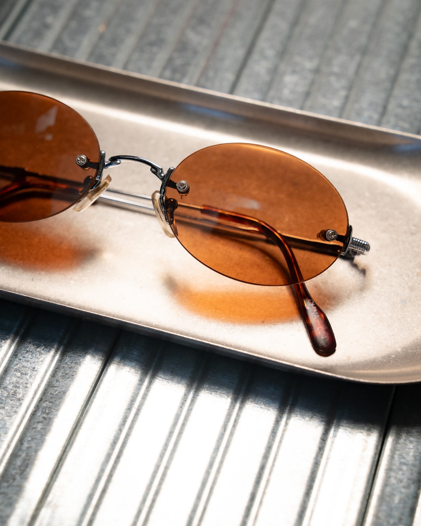 1990s Romaine Rimless Oval Copper Lens Sunglasses